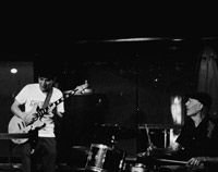 black and white photo of Yuji and drummer live at the Crows Nest first and third Wednesday night
